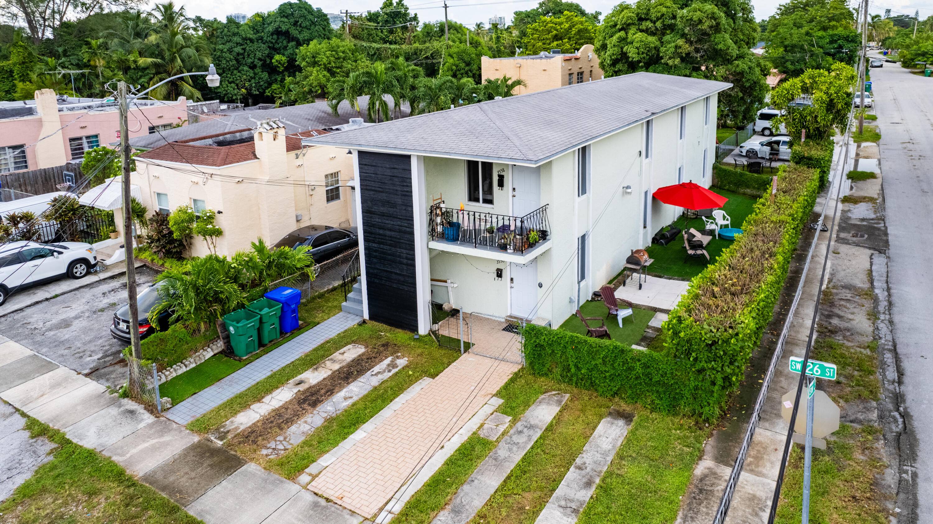Discover Miami living in this corner lot duplex between Coral Gables and Coconut Grove.