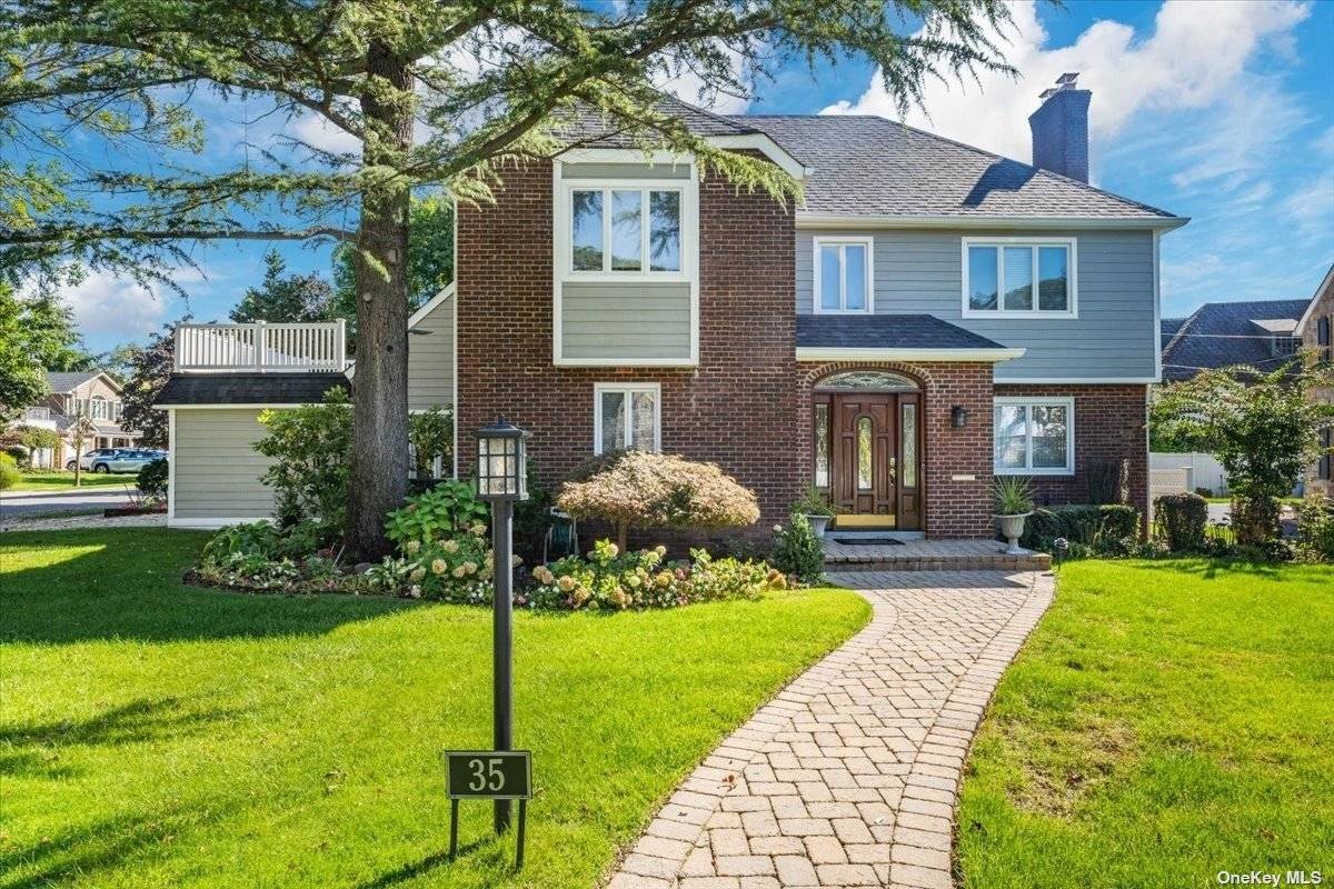 Welcome to this Exquisite Colonial Located on a Private Landscaped Corner Property in the Desirable Old Canterbury Area, Hewitt Elementary School in Rockville Centre.