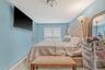 Bedroom with a baseboard heating unit and baseboards