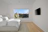Bedroom with light hardwood / wood-style floors