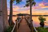 Boat Dock104 Feet Long Wooden Boat Dock23 Ft +/- Boat Lift with a remote dropDual Jet Ski LiftsGazebo with Wooden Table and BenchBuilt In StorageEquip