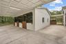 Covered barn workspace ideal for grooming, tacking up, equipment storage, or daily operations