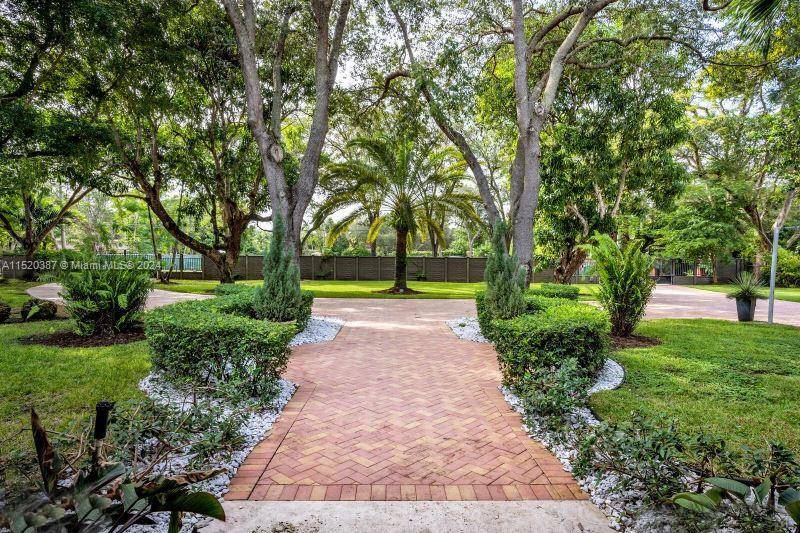 One of a kind and genuinely Unique 4 bed, 4 bath home in South Miami with guest house, a one story home with a huge patio, and a kidney shaped ...