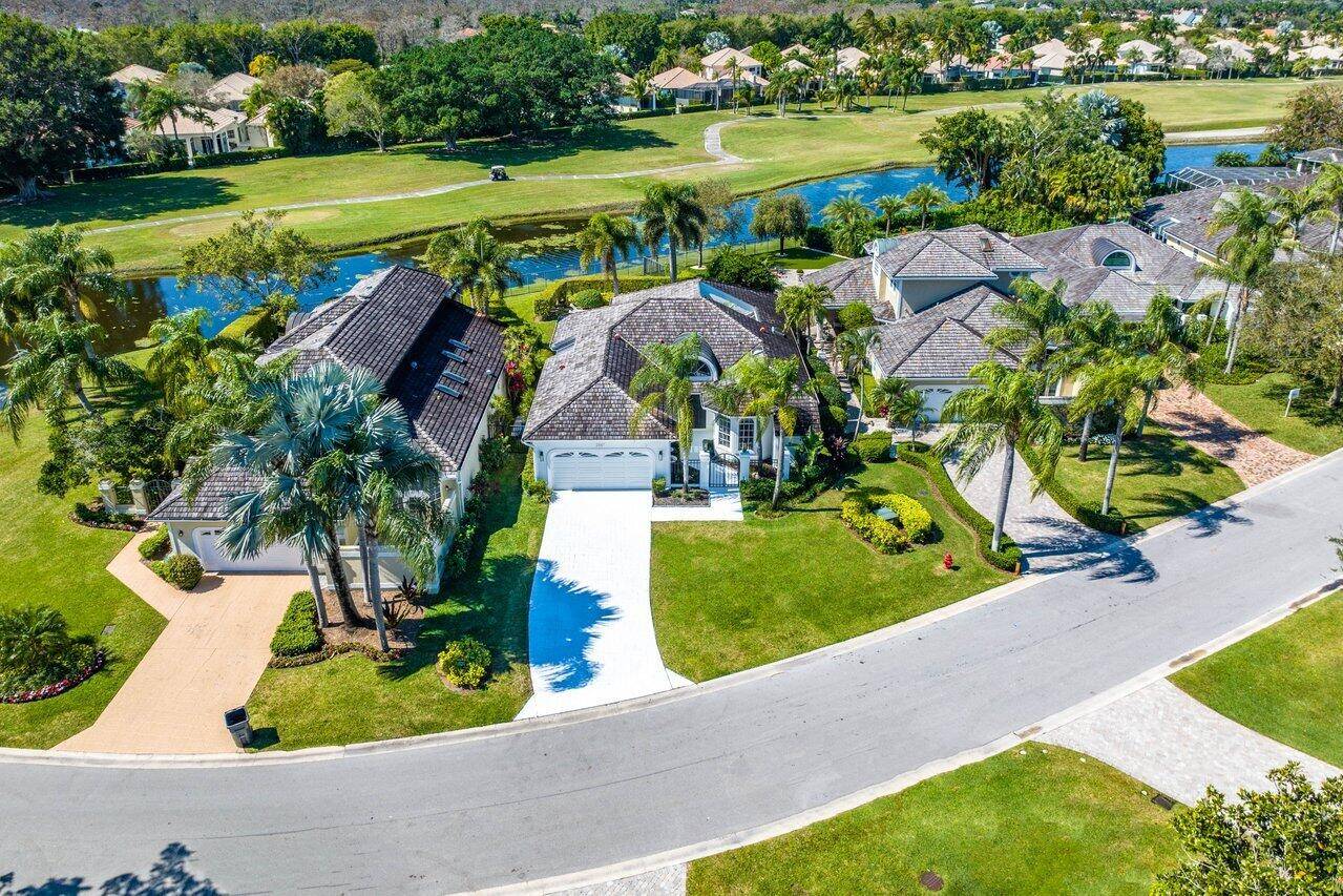 Nestled within the gated community of Palm Beach Polo Golf And Country Club, this one story, 3 bedroom, 2.