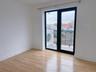 Spare room featuring baseboards and light wood finished floors