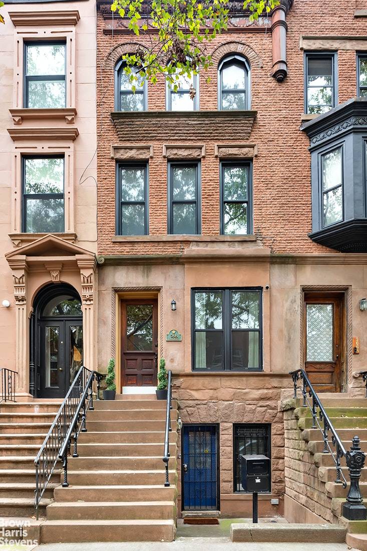 Historic and stylish, this beautifully maintained two unit townhouse sits squarely in the center of Clinton Hill on a picturesque, wide, tree lined street.