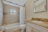 Full bathroom with tub