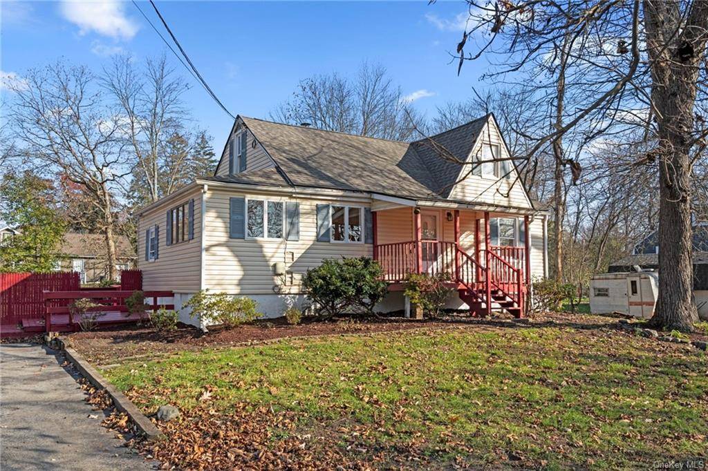 Adorable Cape with a spacious updated kitchen and large living and dining room with new hardwood floors.
