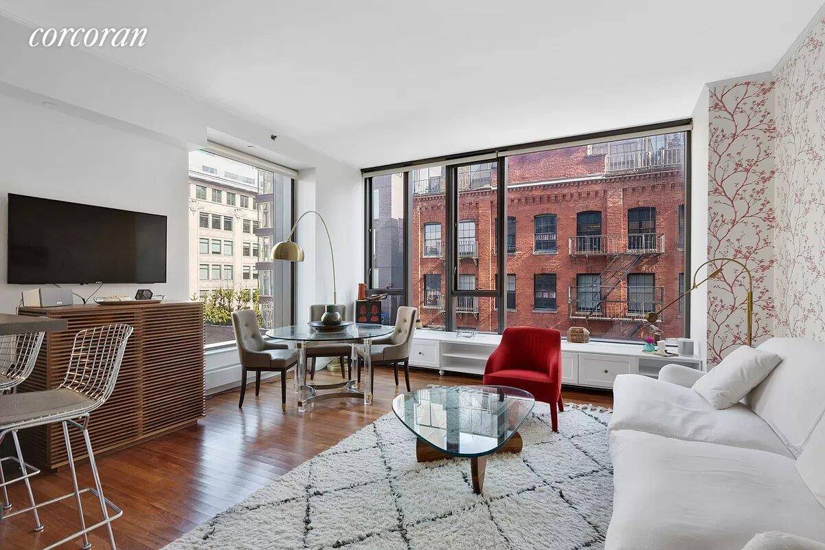 Welcome to 505 Greenwich Street 7E, Spacious 2 Bedroom 2 Bath in full service luxury condo features 10' ceilings, three exposures, open kitchen, and oversized bedrooms.