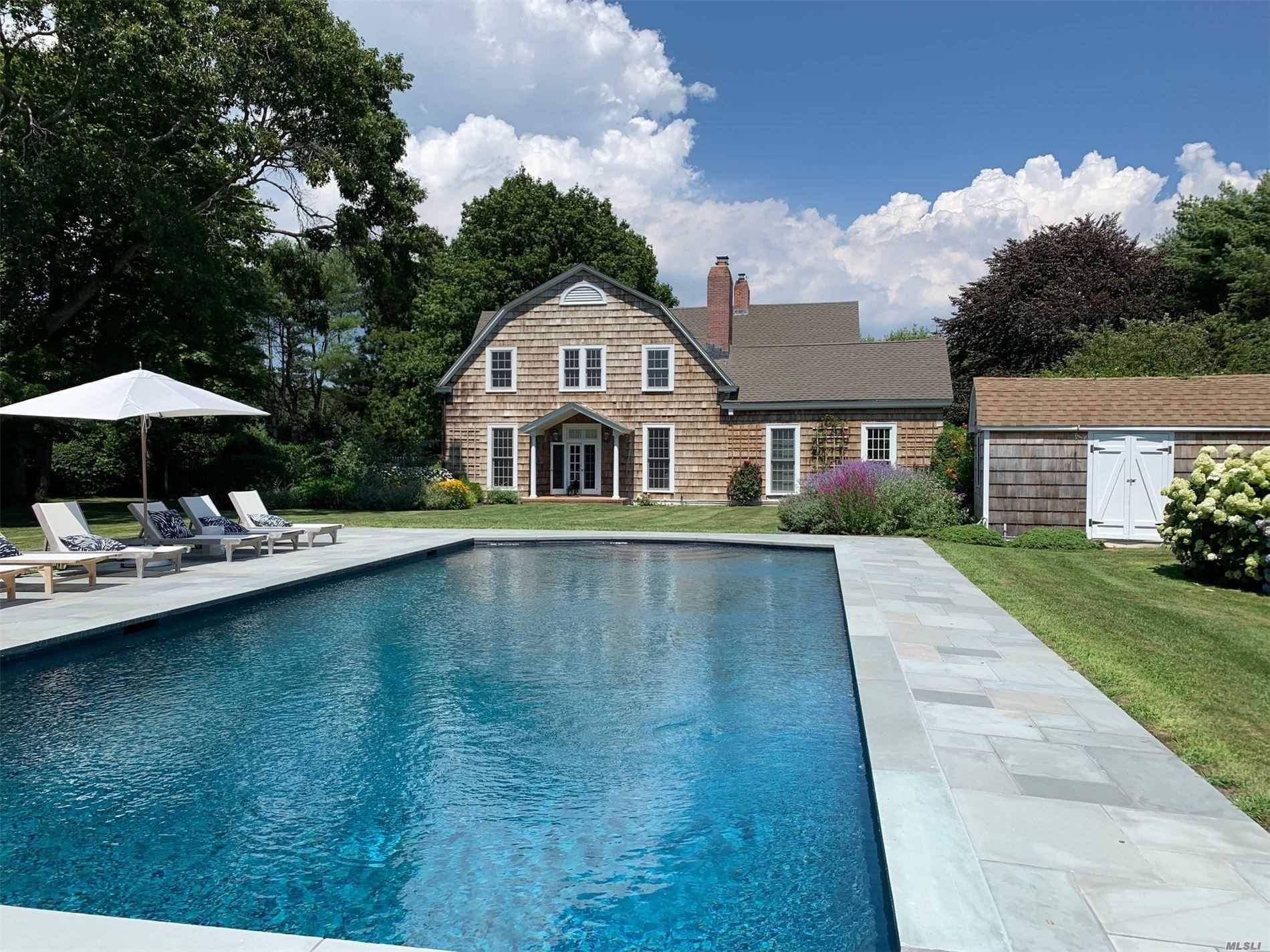 GORGEOUS QUOGUE TRADITIONAL Magnificent 4 BR 5 BA home in the Estate section of Quogue with plenty of living space.