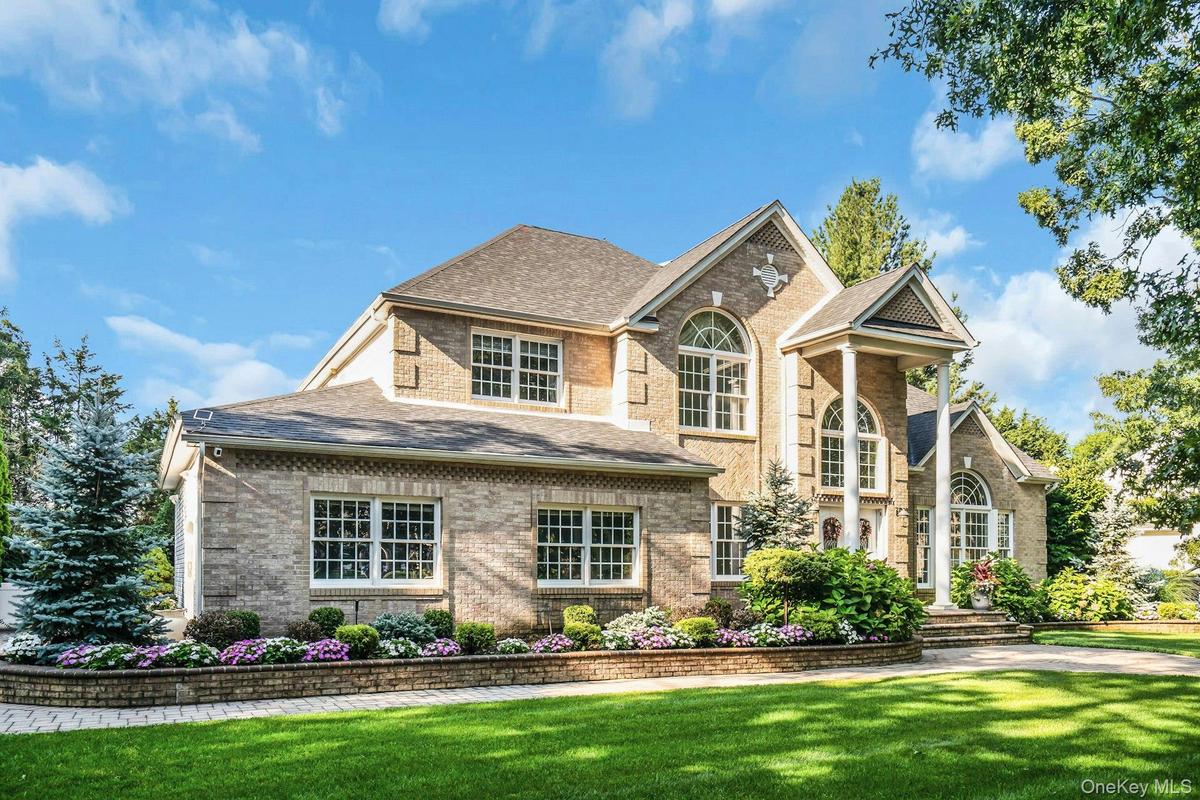 Brick Post Modern Professional Landscaped and Maintained.
