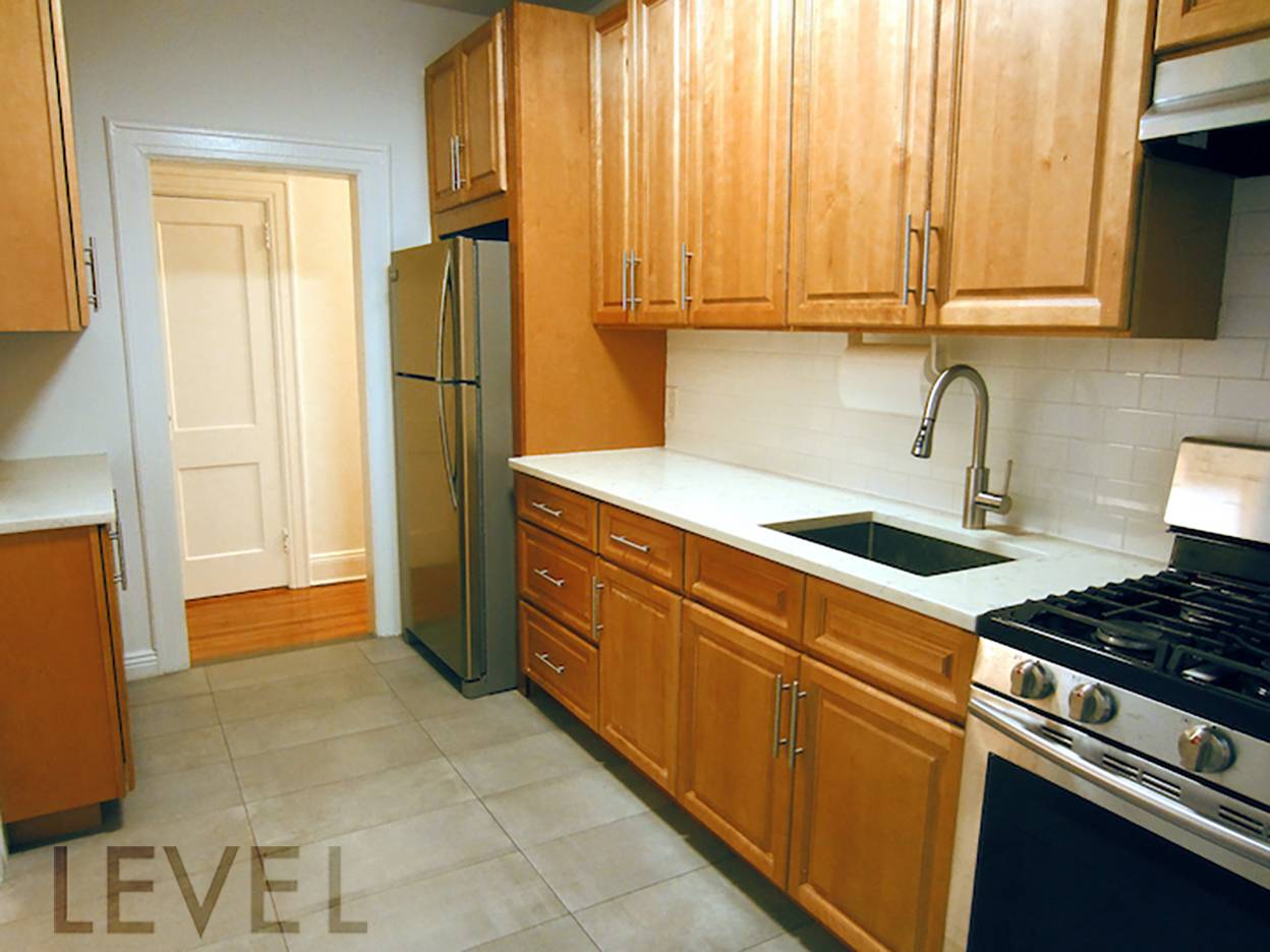 NO FEE Fully renovated two bedroom, one bathroom apartment with windows in every room.