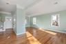 Foyer with stairs, crown molding, light wood-type flooring, and recessed lighting