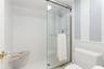 The shower has been updated with beautiful glass sliding doors