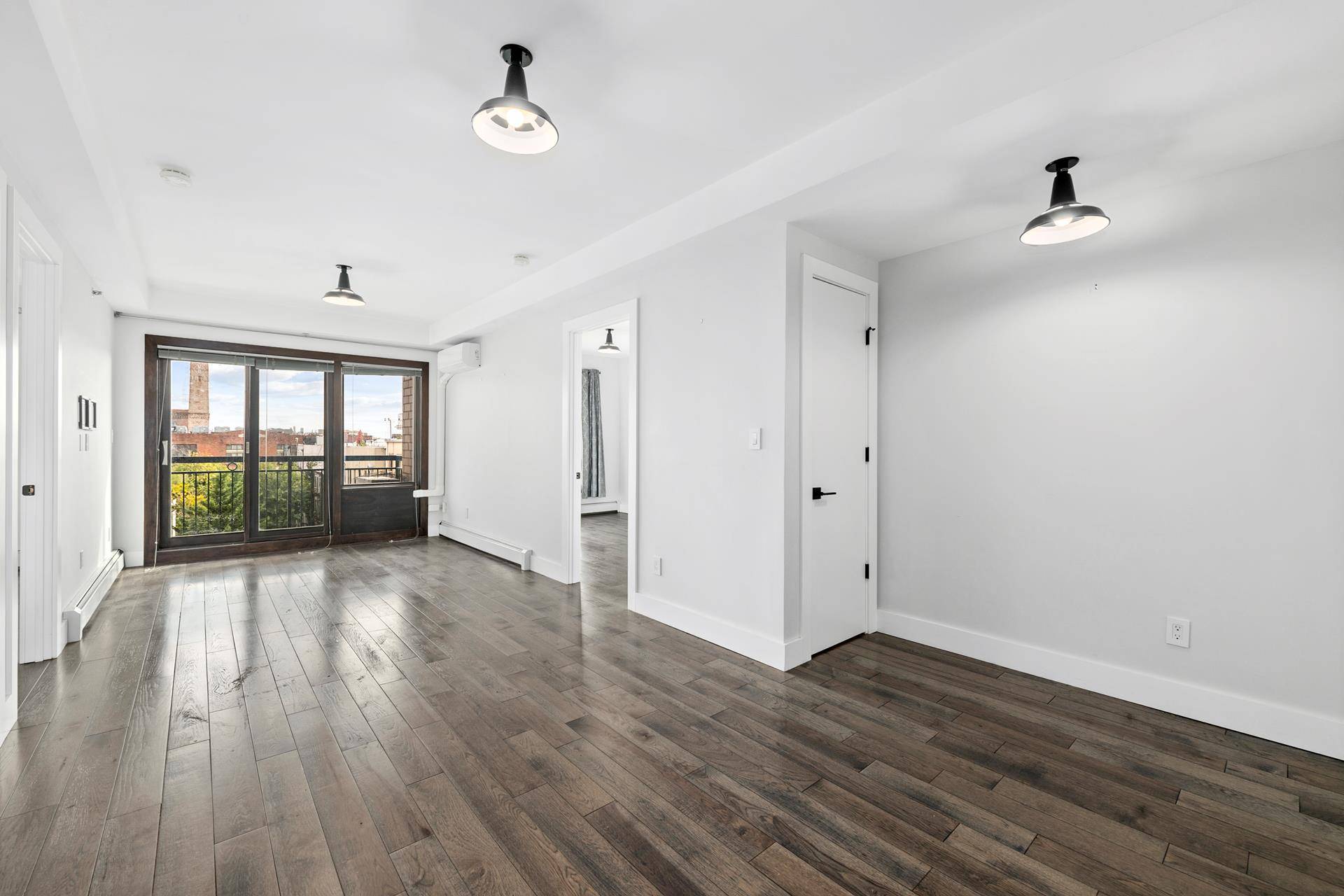 In the heart of East Williamsburg, this pristine two bedroom, one and a half bath condo with balcony underwent a no expense spared renovation in 2020 including Haversham hickory 5 ...
