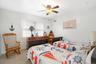 Bedroom with carpet flooring and a ceiling fan