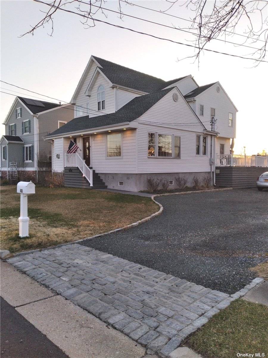 One of a kind, high and dry raised after Sandy post modern colonial with many custom touches Located on quiet street, mid canal w new everything including bulk heading, roof, ...