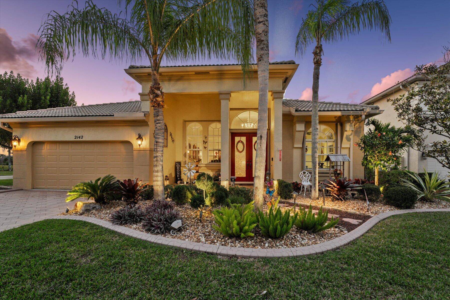 Welcome to 2142 Bellcrest Circle, where luxury meets tranquility in the heart of Royal Palm Beach, FL.