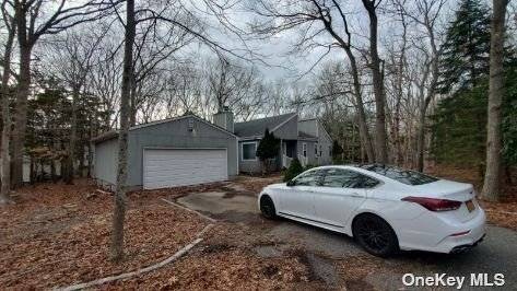 Lovely contemporary on. 49 acre with lots of potential.