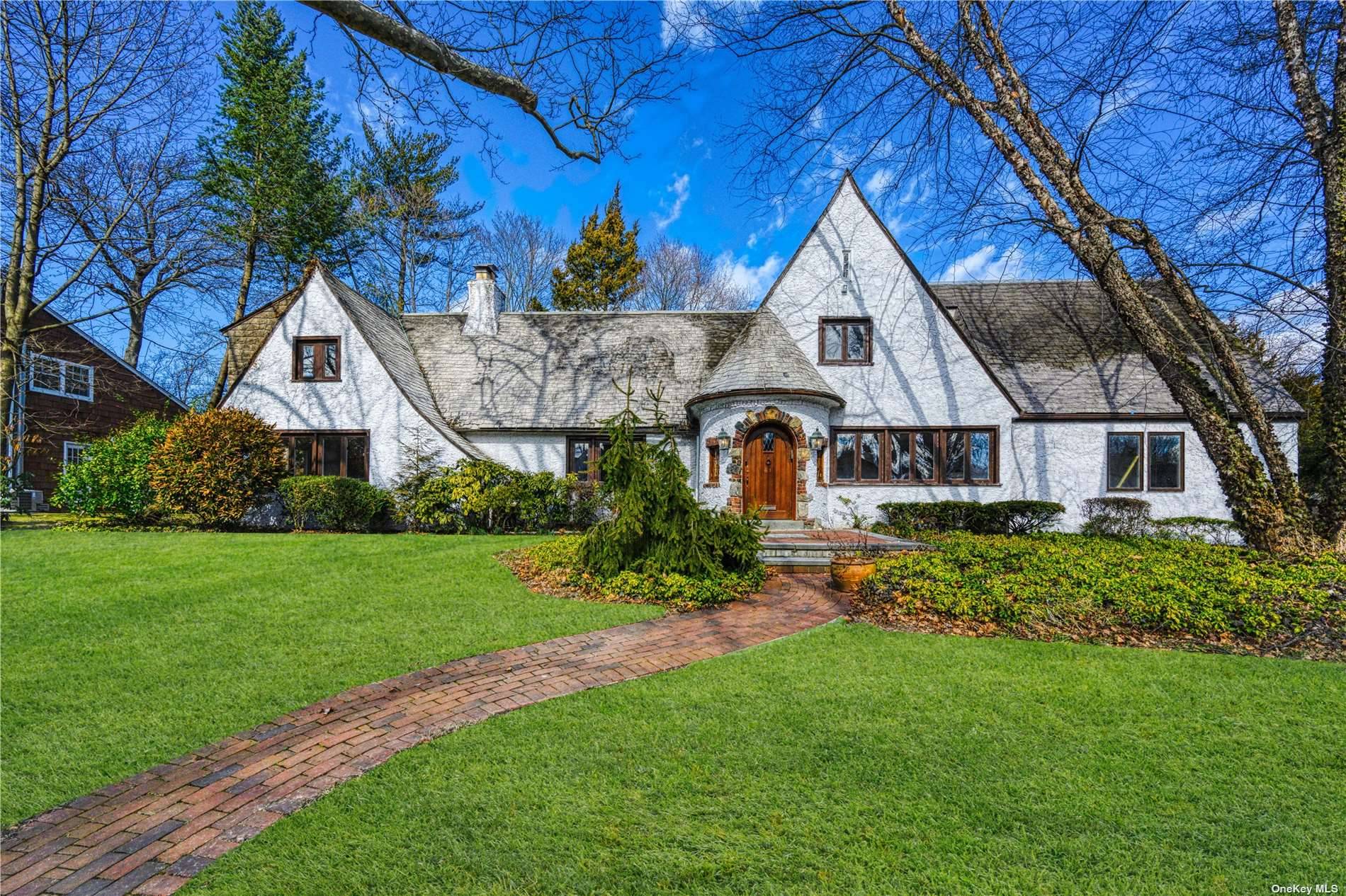 Magnificent Gold Coast Tudor combines old world elegance with modern convenience.