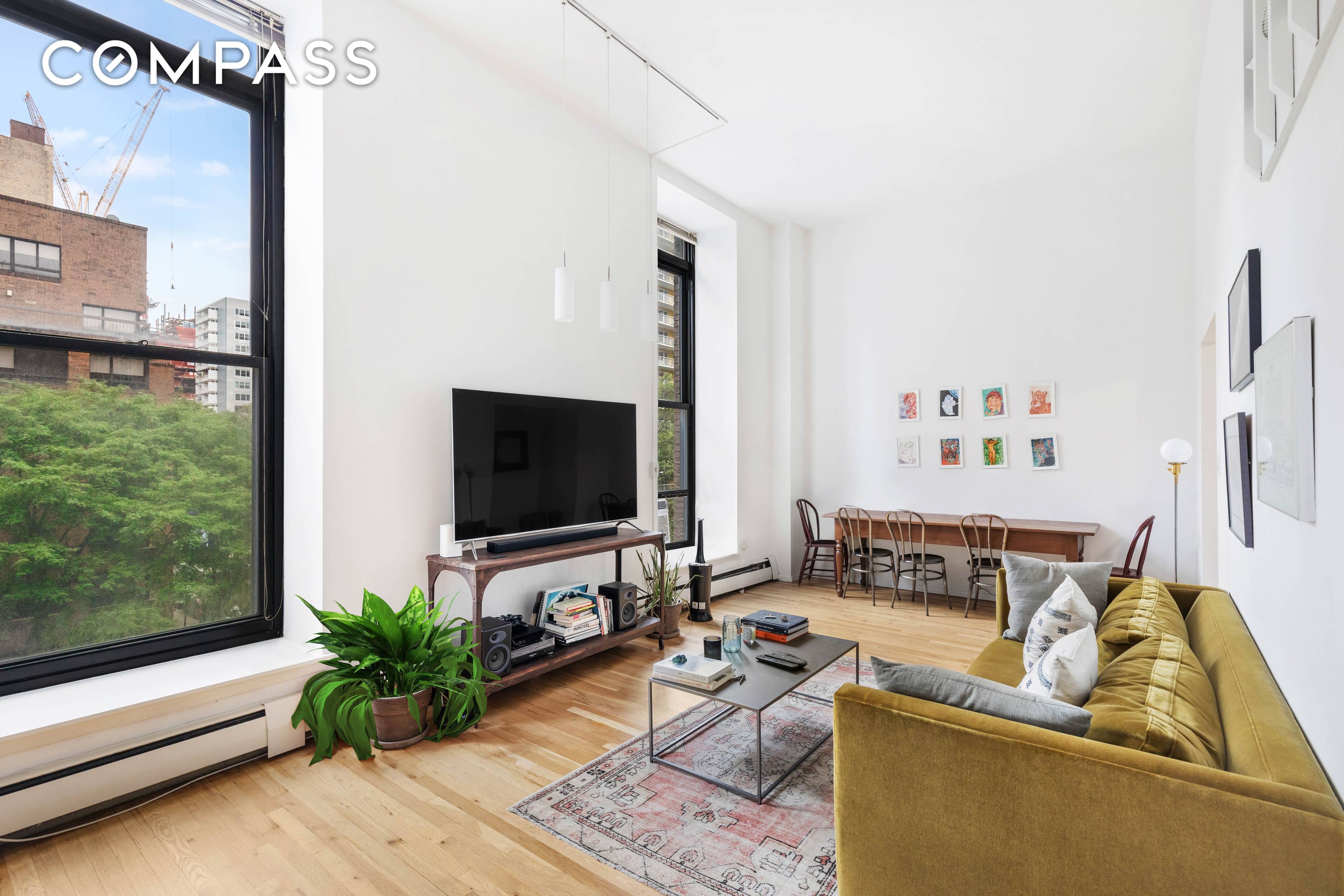 Dramatic Studio loft with 13ft ceilings and a renovated kitchen and bathroom.