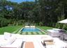 Swimming pool with a yard, outdoor lounge area, and a patio area
