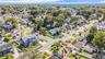 Aerial view of property's location featuring nearby suburban area