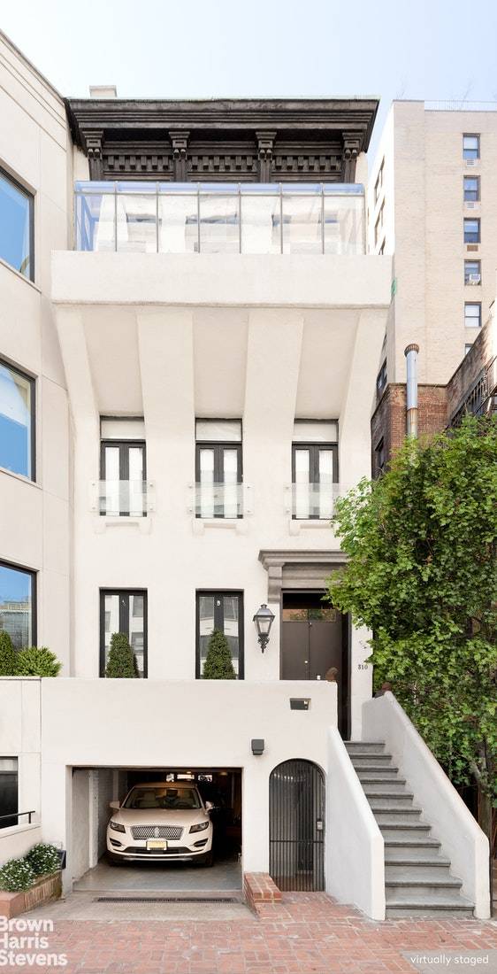 ELEGANT SINGLE FAMILY HOME WITH GARAGE FOR TWO SUVs310 East 69th Street is a spectacular Upper East Side single family home with approximately 4, 375 square feet of interior space, ...