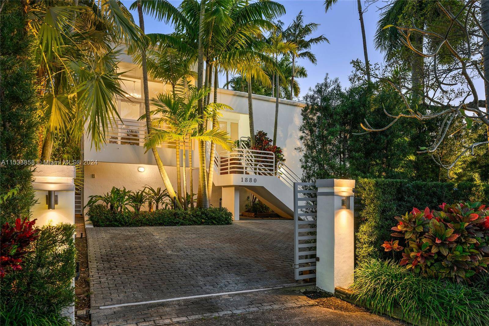 Located in the heart of the much desired North Coconut Grove this tri level home sits on a gated, lushly landscaped 9, 000 SF lot featuring 5BR 4 1BA.