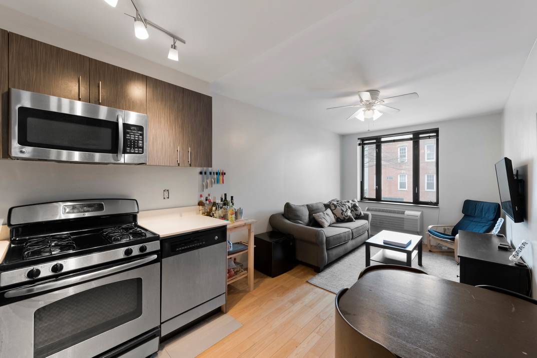 Apartment 2A offers a two bedroom, two bath residence with expansive windows situated on Orient Avenue, one of the most picturesque tree lined streets in Williamsburg, steps from historic Cooper ...