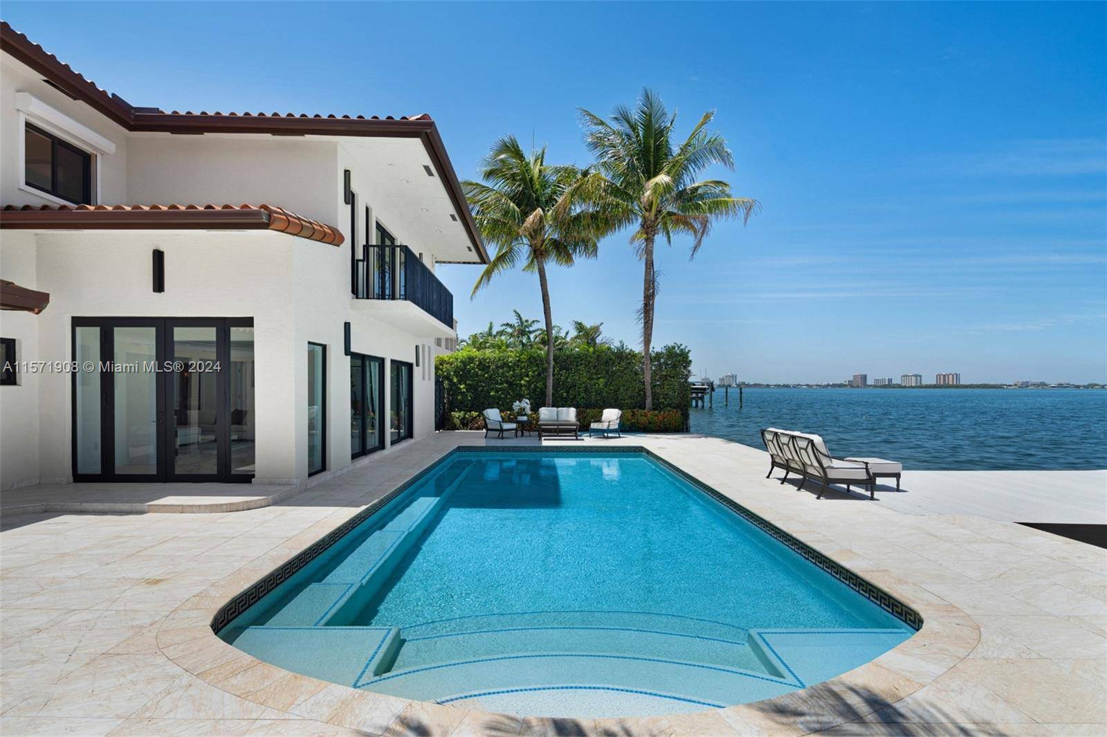 Step Inside With Me ! This Mediterranean abode in the beloved Biscayne Point offers open bay views in this gated neighborhood.