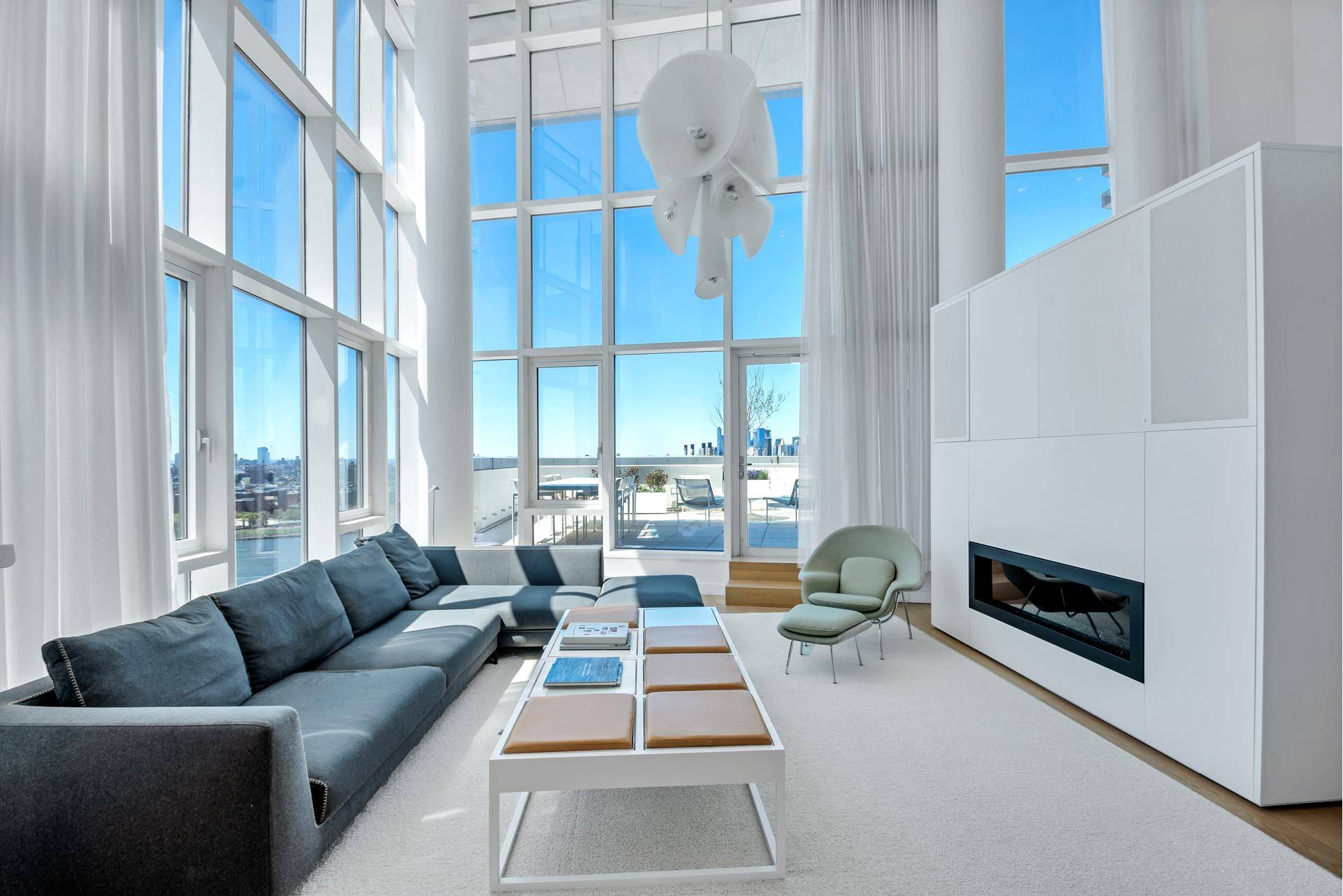 Masterfully envisioned, an incomparable duplex penthouse with a private outdoor terrace overlooking the Manhattan Skyline is now available at the Edge Condominium in Williamsburg.