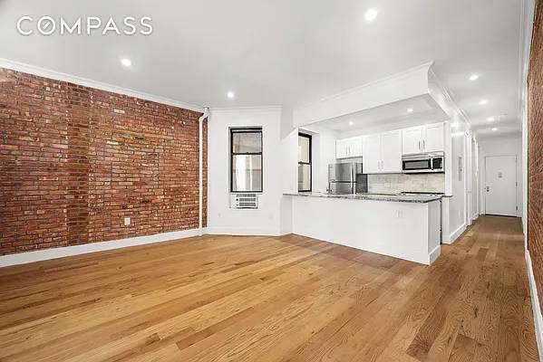 This true five bedroom home with two full baths is set in a charming prewar building on a beautiful Greenwich Village block, steps from Washington Square Park.