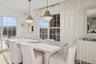 Dining space with healthy amount of natural light and light wood finished floors