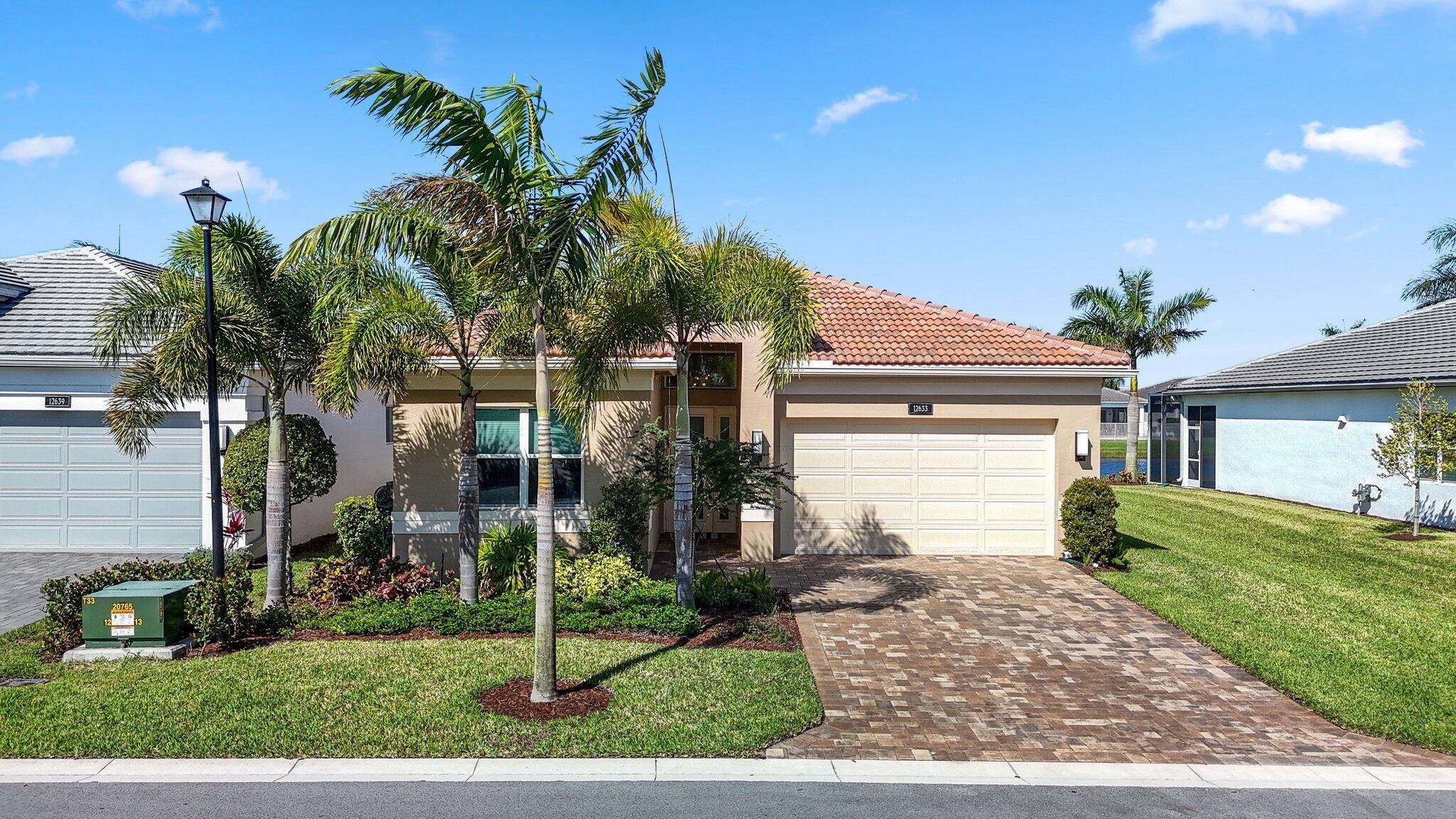Experience the epitome of luxury living at 12633 Vincenza Way, a stunning 3 bedroom, 2 bathroom Ruby model in Valencia Sound, the ultimate 55 development in Boynton Beach, FL.