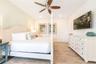 Large bedroom with neutral tones and natural light in Kissimmee vacation home