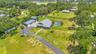 Aerial View of ADU, 6 car garage, Workshop (2 car space) and 2/1 guest unit with a loft and kitchenBrand new Hardie Board siding on ADU, metal roof on