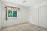 Second bedroom w view of the yard & double closets