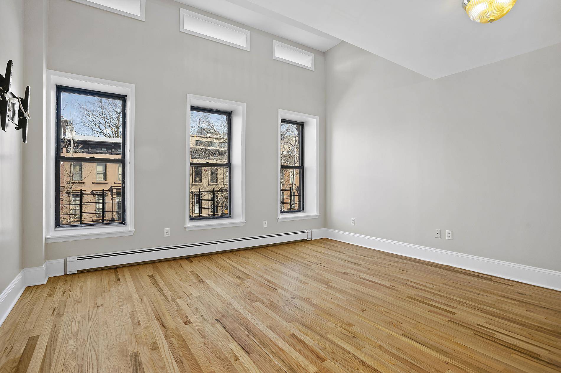 Open and airy upper duplex two bedroom loft style apartment in a modern brownstone located on the axis of Bed Stuy and Bushwick.