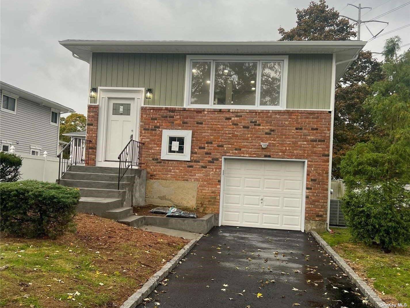 Beautiful Updated Hi Ranch, Possible Mother Daughter w proper permits, Updated Throughout, New Bathroom, Hardwood Floors, oversized open Concept New Kitchen Laundry Room with Sliding Doors to the Rear, New ...
