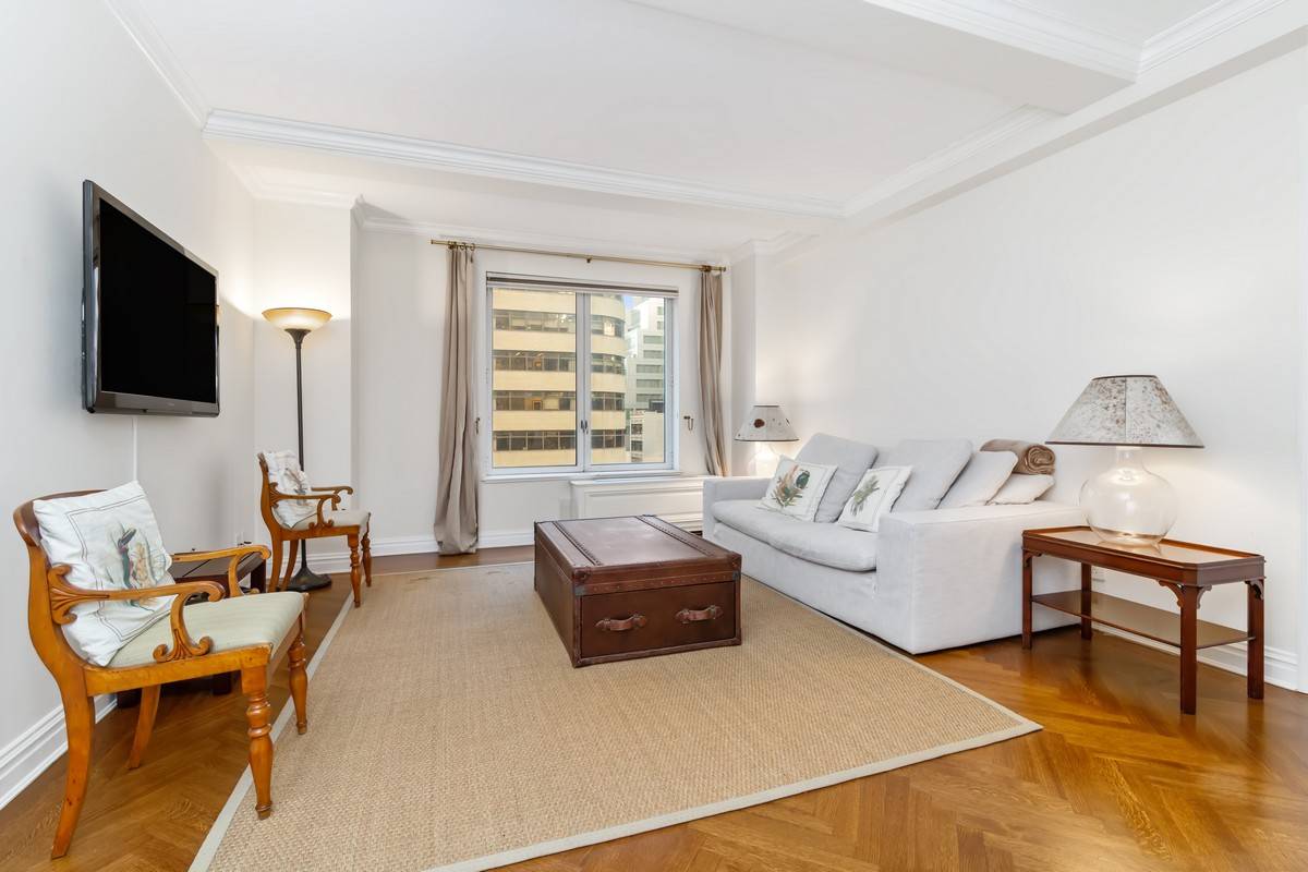 Lovely oversized one bedroom in a full service condominium, centrally located at the cusp of midtown and the Upper East Side.