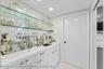 Wet Bar with Laundry Room Beyond