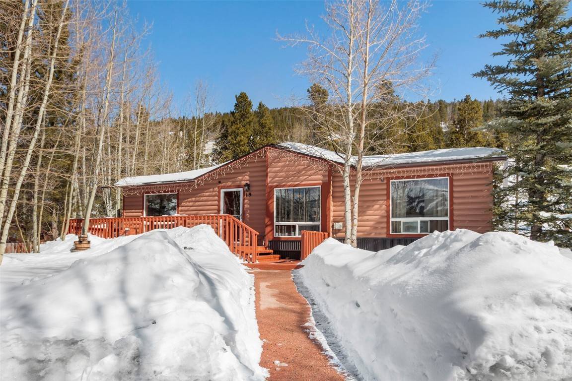 Charming log sided residence with sweeping ski area views located in town with a bus stop conveniently located across the street.