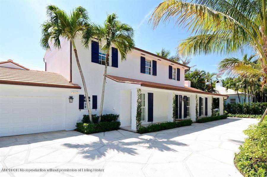 This elegant Palm Beach home is nestled on a private cul de sac on the North End.