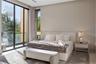Clean-lined en-suite bedroom with upholstered king bed, matching nightstands, neutral textured walls, area rug, light stone floors, sheer drapery, and