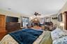 Spacious Primary Suite with Walk-In Closet, Fireplace & Direct Access to the Lanai and Swimming Pool