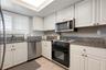 Bright updated kitchen with granite counter tops.