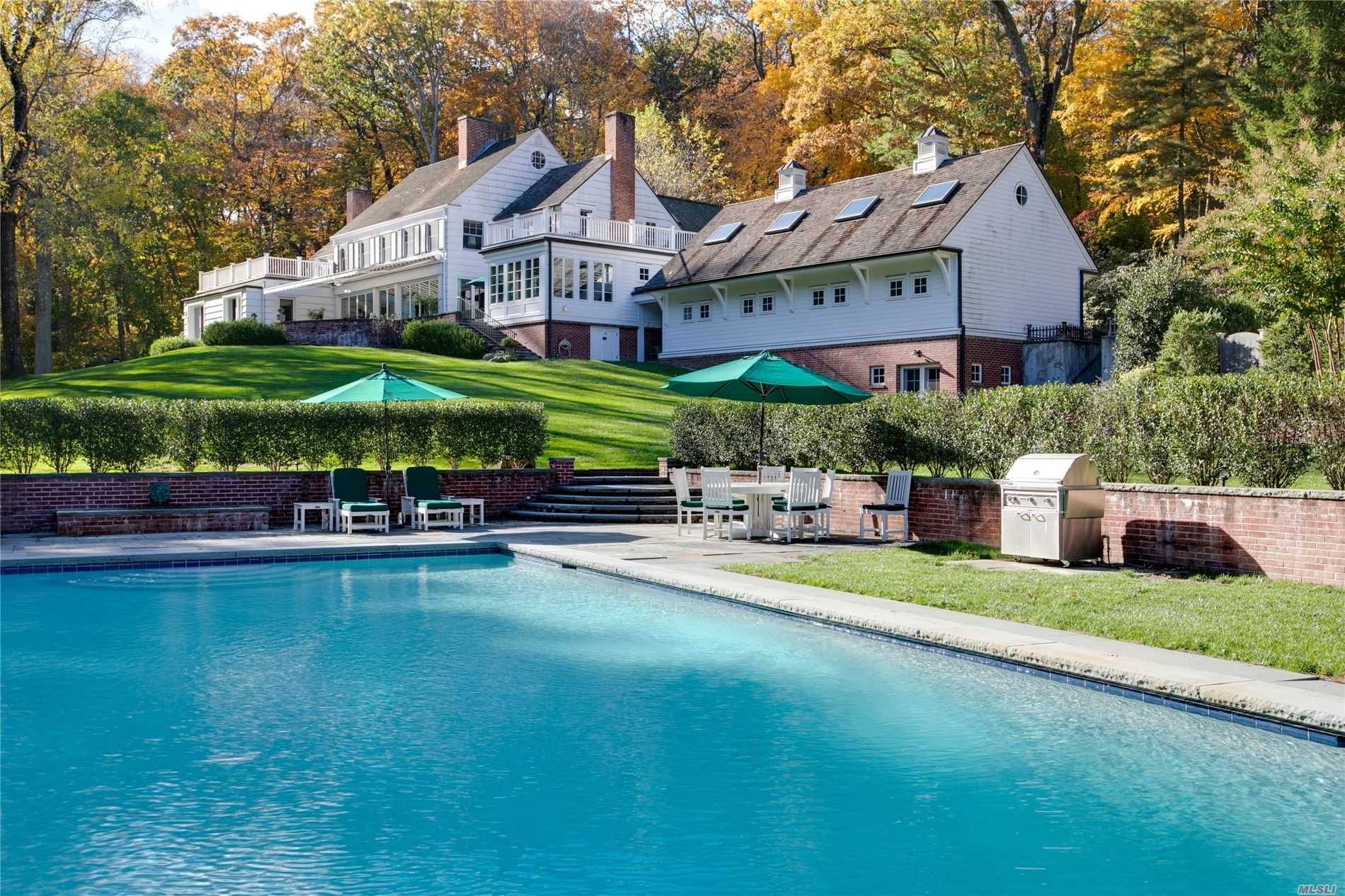 Spectacular Bradley Delehanty designed country oasis in the heart of Matinecock minutes from the quaint shopping village of Locust Valley.