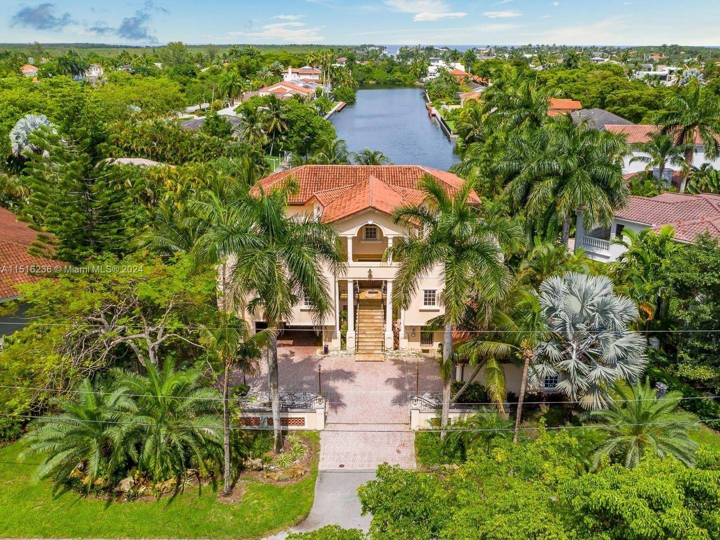Luxurious Mediterranean style gated home in private Gables by the Sea.