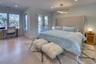 Bedroom featuring access to exterior, french doors, visible vents, light wood-style floors, and baseboards